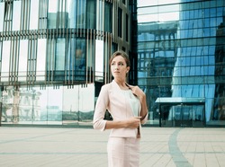 Businesswoman successful woman business person standing outdoor corporate building exterior Pensive elegance cute caucasian confidence professional business woman middle age female leader Bank worker
