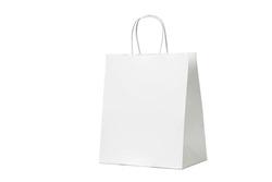 Paper bag on white background with copy space. Eco-friendly white craft bag isolated. 