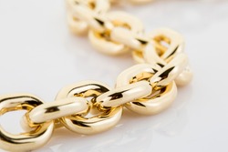 Gold jewelery. Gold chain isolated