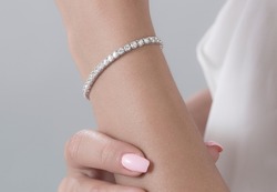 Diamond jewelry. Diamond bracelet on woman 