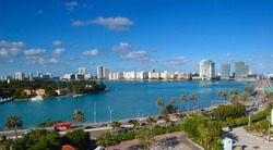 skyscrapers and office building in the city of miami florida against the ocean background