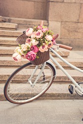 toned image of vintage bike with flowers