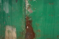 Old rusted green wall. Grunge background. Distressed texture        