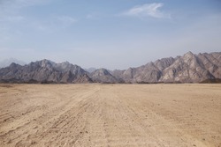 Desert on a background of mountains