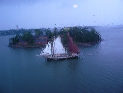 Sailboat through the window in rainy day
