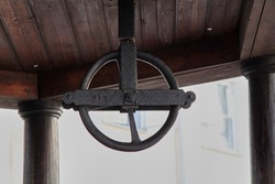 Ring of an old water well on a medieval town. High quality photo. Selective focus
