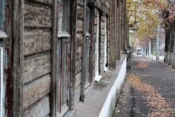 Street in an old city with fallen yellow leaves, autumn . Selective focus. High quality photo