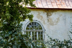A window of an old medieval protestant church, Estonia. High quality photo. Selective focus 