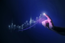 Close up of man hand pointing at glowing business chart on dark blue background. Stock, market and trade concept. Double exposure