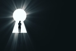 Backlit business woman standing in bright keyhole opening on dark background with mock up place and light rays. Dream, future and opportunity concept