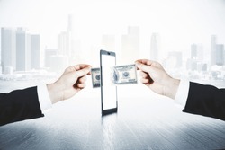 A man passes another man money through smartphone, online money transfer concept