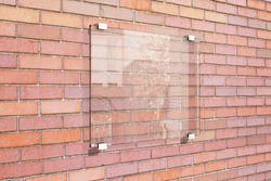 Transparent signboard on red brick wall, mock up