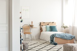White and wood scandinavian kid's room with comfortable single bed and workspace with desk and chair