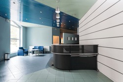 Blue and grey reception in a hallway of factory