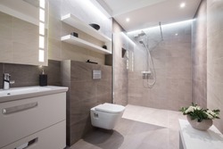 Exclusive modern white bathroom with glass shower