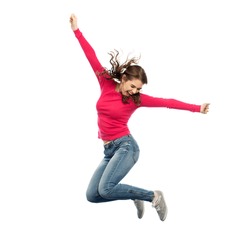 happiness, freedom, motion and people concept - smiling young woman jumping in air over white background