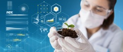 science, biology, ecology and research concept - close up of young female scientist wearing protective mask holding petri dish with plant and soil sample over blue background and virtual charts
