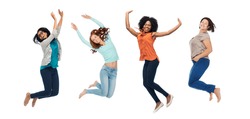 happiness, diverse, motion and people concept - happy international women jumping in air over white background