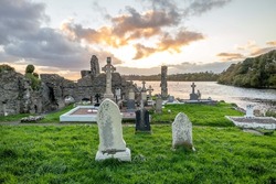 The sun is setting above the Abbey Graveyard which was build by Hugh O Donnell in 1474 - all names and artwork removed