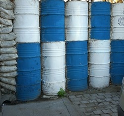 Barrels and sand bags used to demarcate or to divide or separate. This photo depicts a part of the wall between Greek and Turkish controlled city of Nicosia,Cyprus.  