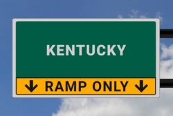 Kentucky logo.  Kentucky lettering on a road sign. Signpost at entrance to  Kentucky, USA. Green pointer in American style. Road sign in the United States of America. Sky in background