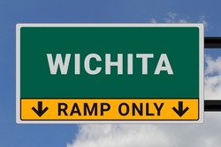 Wichita logo. Wichita lettering on a road sign. Signpost at entrance to Wichita, USA. Green pointer in American style. Road sign in the United States of America. Sky in background
