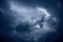 Fine art: landscape photo of dark clouds, threatening a thunderstorm, blue tint  