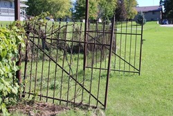 cast iron gates to a cemetery open