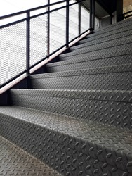 a checkered plate steel stair suitable to use in heavy traffic like the factory.