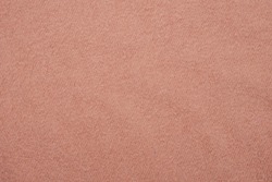 Texture of soft pink fleecy fabric.
