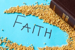 Strong faith like a mustard seed in God Jesus Christ. Parable of hope and trust. Golden Holy Bible with handwritten word text. The gospel of Matthew 17:20. Faithful Christian concept.