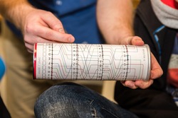 Paper imitation of a cylinder from an encryption, coding, secret enigma machine. Used for teaching or playing for children, students or logical training or cryptography studies at a university.