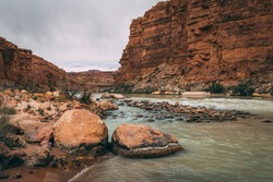 Standing in the Colorado River after hiking the Cathedral Wash trail at the Glen Canyon National Recreation Area in Arizona
