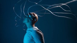 bald man with electrodes in his brain, a man of the future with technological additions, the brain is connected to virtual reality, additional opportunities for the brain, expansion of consciousness.