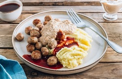 Swedish meatballs kottbullar, mashed potato, onion sauce and lingonberry sauce.