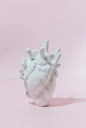 Sculpture Heart on a pink background. Creative Love, Valentine's day concept.