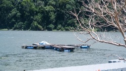 traditional fish cages with floats from used plastic barrels in Sabang, We Island. Aquaculture fish farming