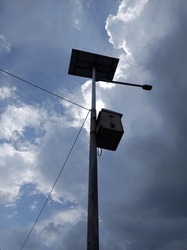 Stock photo of street light and power cord backlite angle