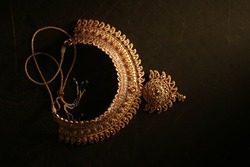 Indian Traditional Jewellery. Top view of Necklace on black background. selective focus