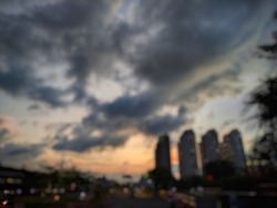 Unfocus. abstract blurred picture of sky with sunset on city street