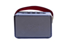 Retro style Bluetooth speaker with volume knob and strong metal grille, ready to hold (speaker) isolated on white backgroundisolated