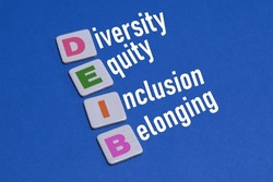 Diversity, Equity Inclusion and Belonging (DEI) Words. Colorful DEIB Tiles Making Words: Diversity, Equity, Inclusion and Belonging. Business Concept of DEIB on Blue Background.