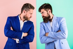 Businessmen stylish appearance jacket pink blue background. Tense face expression competitors. Business competition and confrontation. Business partners competitors in suits with tense bearded faces.