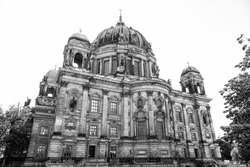 Berlin Cathedral. Architectural heritage. Church or cathedral with domes. Tower cross on top of roof. Old city architecture concept. Cathedral big dome copper patina roof. Gorgeous cathedral facade