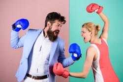 Conflict concept. Family quarrel. Boxers fighting in gloves. Domination concept. Gender battle. Gender equal rights. Gender equality. Man and woman boxing fight. Couple in love competing in boxing.