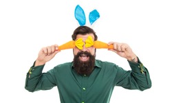 happy bearded man wear bunny ears. happy easter menu. easter carrot. hipster wearing rabbit ears. time for fun. cheerful guy holding carrots. spring holiday greeting. eastertide.