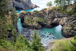 Where rocky coastline jut out into sea. Sea arches and coastal inlets. Rocky coast in Oregon, USA