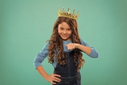 I am the best. Kid wear golden crown symbol princess. Every girl dreaming become princess. Lady little princess. Girl wear crown turquoise background. Spoiled child concept. Egocentric princess