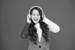 Life is song, sing it. Happy child sing song red background. Little girl listen to song in headphones. Modern life. New technology. Music and song. Fun and entertainment