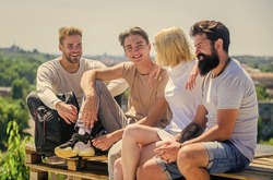 Men and woman talking nature background. Spending time with friends. Carefree friends. True friendship. Being sincere with closest people. Discussing ideas. Summer vacation. Cheerful friends relaxing